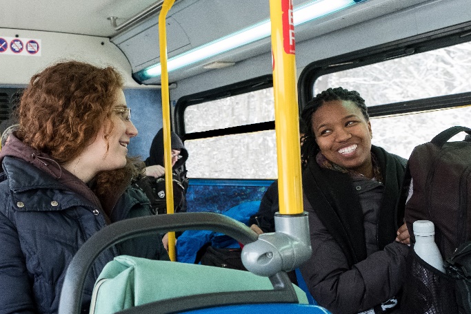 Two rides commute together on AT bus